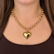 KIMÉ Kralenketting met hart – goudkleurig